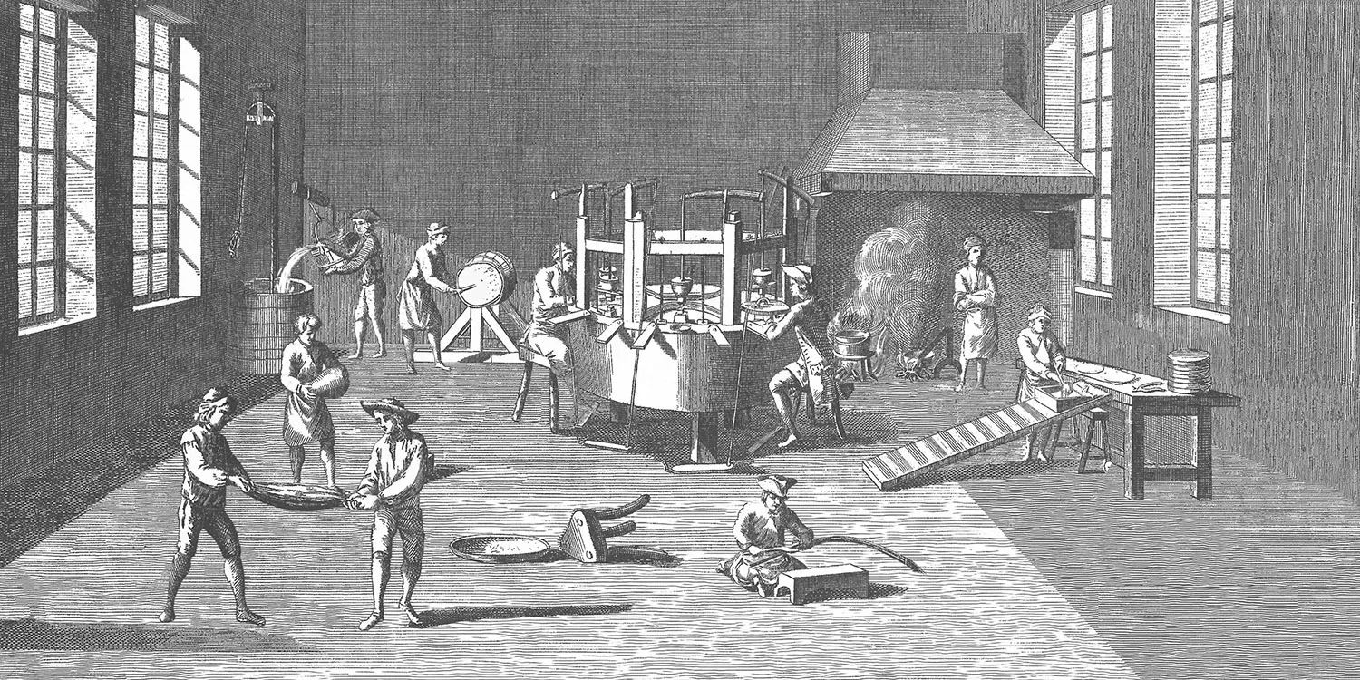 Engraving of a pin factory workshop with workers at specialized stations, each performing one step of the pin-making process