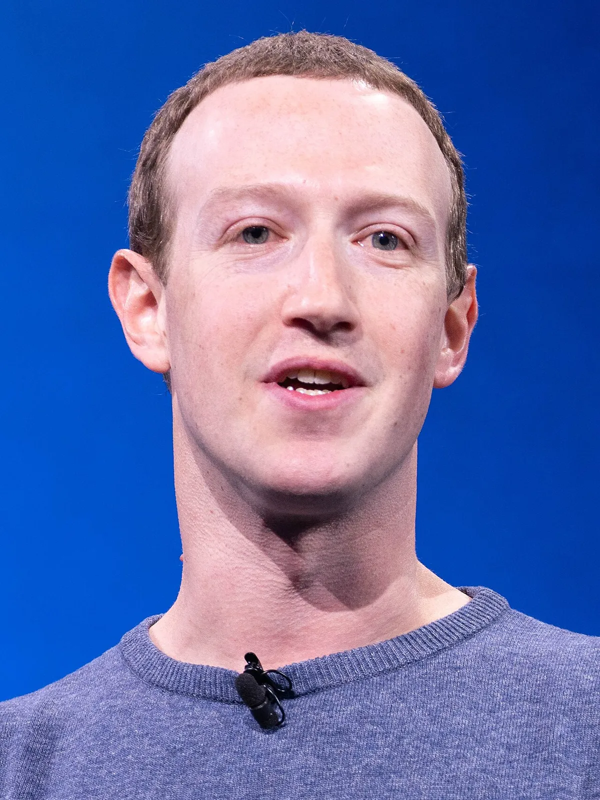 Portrait of Mark Zuckerberg speaking at a conference.